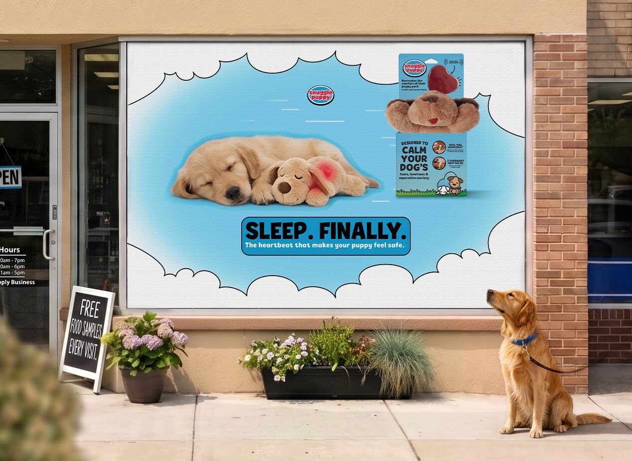 Storefront window ad showing sleeping golden retriever puppies and Snuggle Puppy products with the slogan 'Sleep. Finally.'