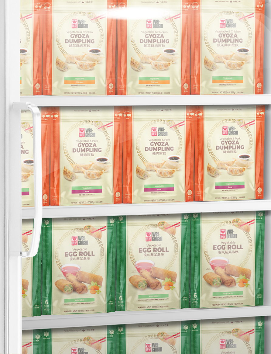 Assorted Wei-Chuan frozen dumpling and egg roll packets on a grocery freezer shelf by color-coded sections (orange red and green).