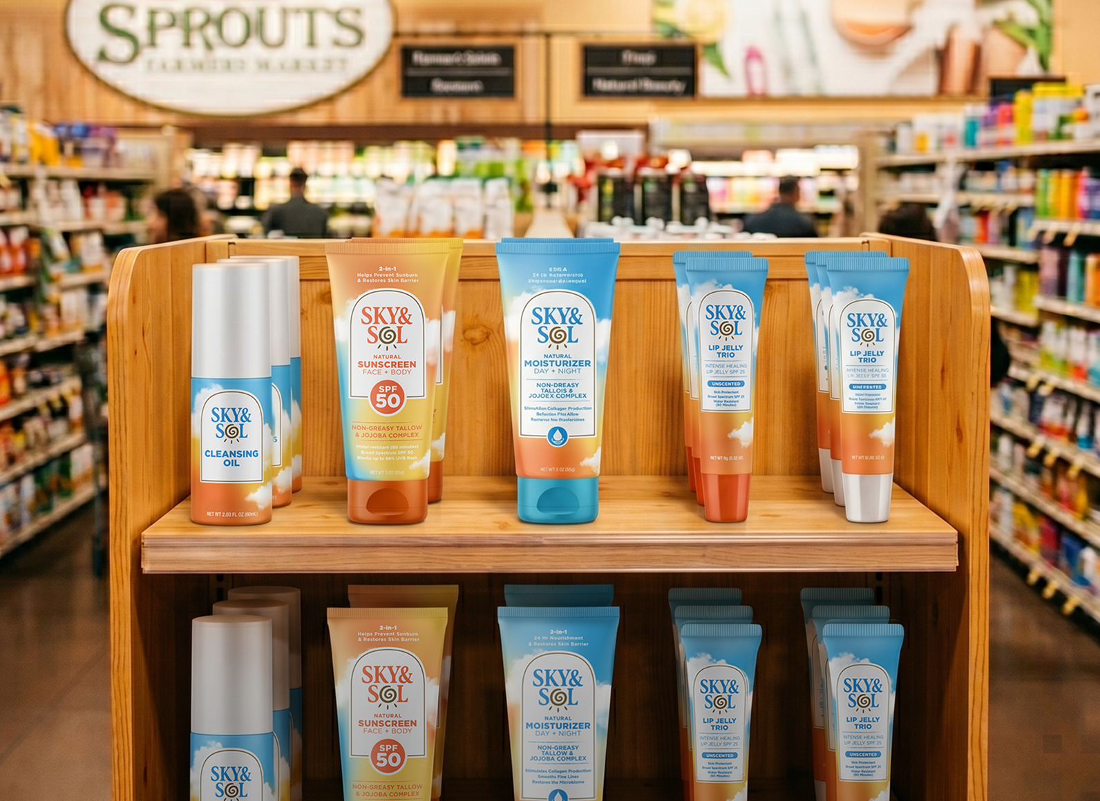 Shelf display of Sky & Sol sunscreen and skincare tubes on a wooden stand in a grocery store aisle