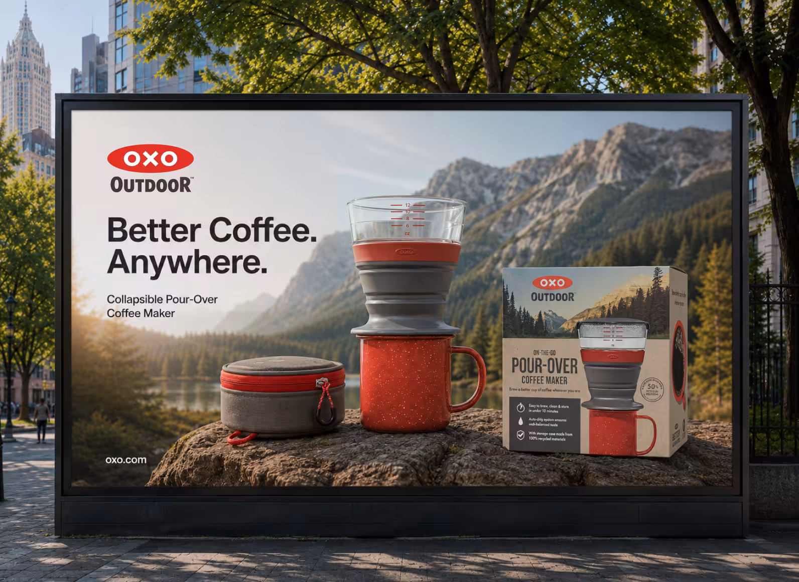 Billboard ad for OXO Outdoor Pour-Over Coffee Maker showing a red mug and multi-layer pour-over device with a nature mountain backdrop and the slogan 'Better Coffee. Anywhere.'